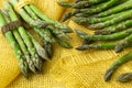 Bunches of asparagus tied with twine on a burlap background. Asp Royalty Free Stock Photo