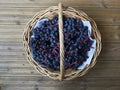 bunches of blue ripe grapes in a wicker basket