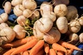 Bunches of carrots and fresh turnips on a market stall