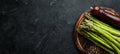 bunches of fresh green asparagus on a black background. Healthy food. Top view. Royalty Free Stock Photo