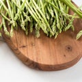 bunches of fresh green asparagus on wooden background, top view