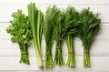 Bunches of fresh green herbs on a white wooden background. parsley, dill, onion Royalty Free Stock Photo