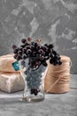 Bunches of fresh ripe red grapes on a concrete textural surface. Branch of pink grapes. Red wine grapes. dark grapes Royalty Free Stock Photo