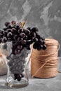 Bunches of fresh ripe red grapes on a concrete textural surface. Branch of pink grapes. Red wine grapes. dark grapes Royalty Free Stock Photo