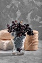 Bunches of fresh ripe red grapes on a concrete textural surface. Branch of pink grapes. Red wine grapes. dark grapes Royalty Free Stock Photo