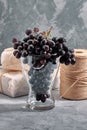 Bunches of fresh ripe red grapes on a concrete textural surface. Branch of pink grapes. Red wine grapes. dark grapes Royalty Free Stock Photo