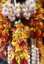 Bunches of garlic and colorful chilli peppers