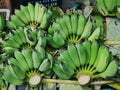 Bunches of Green Bananas for Sale at Market Stall Royalty Free Stock Photo