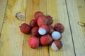 Bunches of Lychees fruit on wooden table background