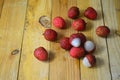 Bunches of Lychees fruit on wooden table background