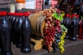 Bunches of white, pink and dark grapes on an old wooden wine barrel. Royalty Free Stock Photo