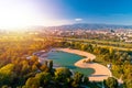 Bundek lake and city of Zagreb aerial autumn sun haze view