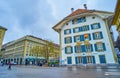 Bundesplatz square with medieval mansion with blue window shutte