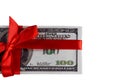 Bundle of bills of one hundred dollars tied with a red ribbon. Dollars isolated on white background. Royalty Free Stock Photo