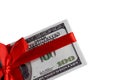 Bundle of bills of one hundred dollars tied with a red ribbon. Dollars isolated on white background. Royalty Free Stock Photo