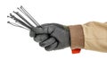 Bundle of black plastic cable ties in electrician hand in black protective glove and brown uniform isolated on white background