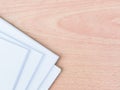 A bundle of blank white paper on wooden table. Royalty Free Stock Photo