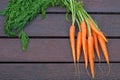 Bundle of carrots on the wood