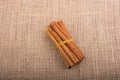 bundle of Cinnamon sticks on canvas Royalty Free Stock Photo