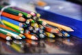 Bundle of colored pencils on a smooth surface. Royalty Free Stock Photo