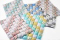 Bundle of colorful patchworked comforters with unicorn and stars design on white background - six pieces.