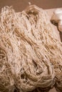 A bundle of cotton hemp rope and silk raw material close-up