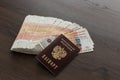 A bundle of five thousand Russian rubles is spread out on the table. There are passports Royalty Free Stock Photo