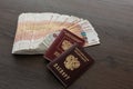 A bundle of five thousand Russian rubles is spread out on the table. There are passports Royalty Free Stock Photo