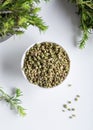 Bundle of fresh green aromatic thyme herbs with dried thyme seeds in a bowl. Royalty Free Stock Photo