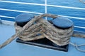 Bundle of marine ropes on the mooring bollard