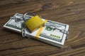 Bundle of money dollars of banknotes, a locked lock with a chain. Royalty Free Stock Photo