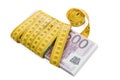 Bundle of money rewound measuring tape