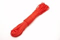 Bundle of neatly twisted red nylon rope on a white background Royalty Free Stock Photo