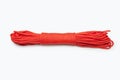 Bundle of neatly twisted red nylon rope on a white background Royalty Free Stock Photo