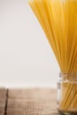 Bundle of raw spaghetti in glass jar Royalty Free Stock Photo