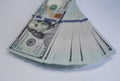 A bundle of real 100 banknotes on a white table Royalty Free Stock Photo