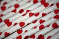 Bundle of straws with printed hearts. Royalty Free Stock Photo