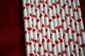 Bundle of straws with printed hearts. Royalty Free Stock Photo