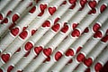 Bundle of straws with printed hearts. Royalty Free Stock Photo