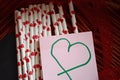 Bundle of straws with printed hearts. Royalty Free Stock Photo