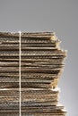 Bundle of waste cardboard tied with string close-up Royalty Free Stock Photo