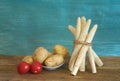 Bundle of white asparagus, potatoes and tomatos