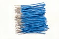 Bundles of blue electrical wires without insulation. white background, close-up Royalty Free Stock Photo