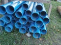 Bundles of blue plastic pipes for water transport. Pipe batch Royalty Free Stock Photo