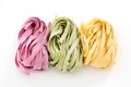 Bundles of dried ribbon color pasta