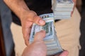 Bundles of US dollars in the hands of businessman. Selective focus Royalty Free Stock Photo