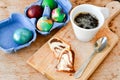 Bundt easter marble cake, blue easter egg and cup of coffee