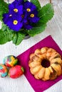 Bundt easter marble cake, easter eggs and Primrose - Primula vulgaris Royalty Free Stock Photo