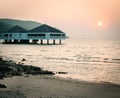 Bungalow near the sea with sunset