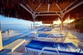 Bungalow on the sea at sunset. Wooden pavilions on the shore of a sandy beach - Bodrum, Turkey Royalty Free Stock Photo